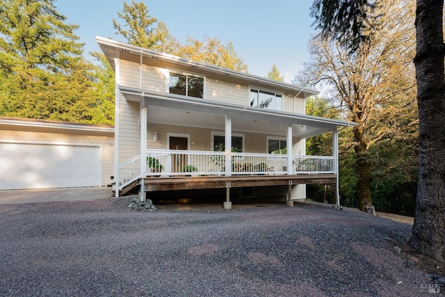 view of front of house featuring a garage and a porch