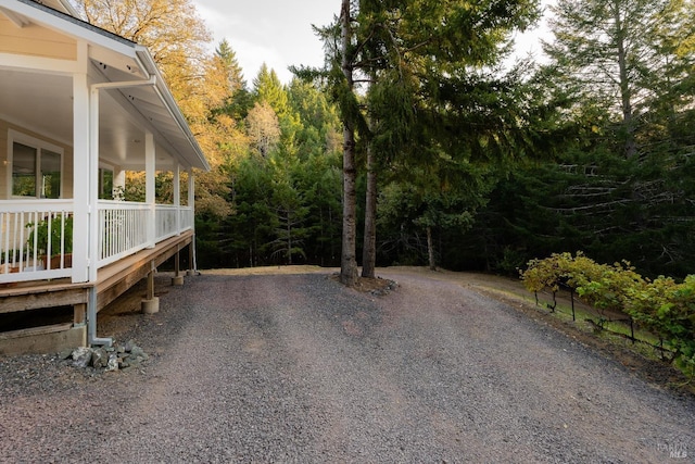 exterior space featuring a view of trees
