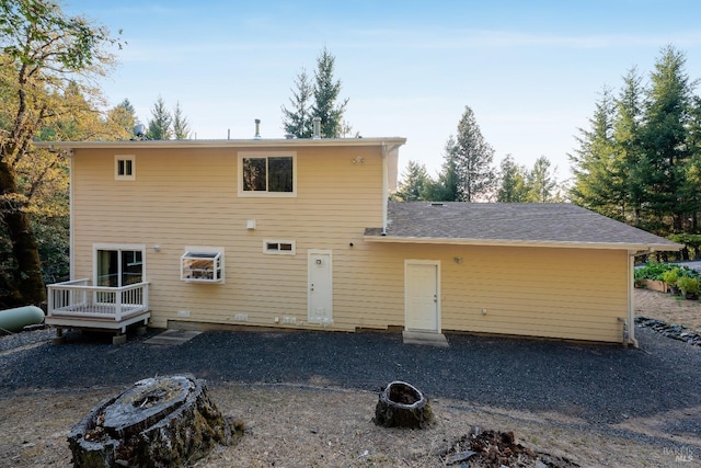 rear view of house with a deck