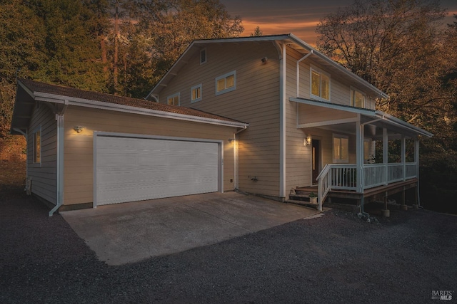 view of front of house featuring a garage and covered porch