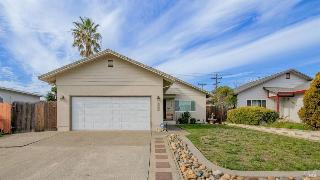 view of front of property featuring a garage and a front yard