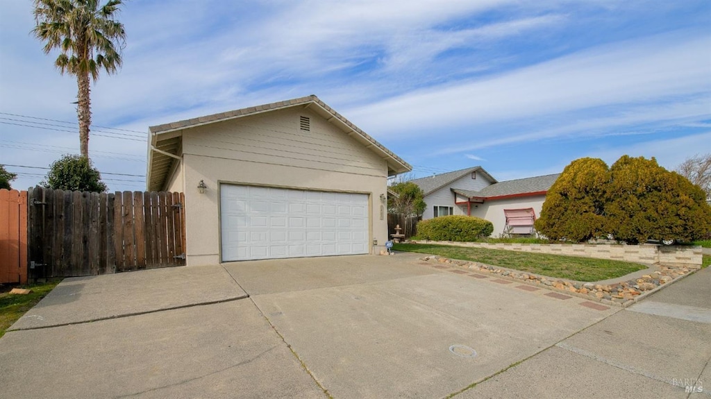 ranch-style home with a garage