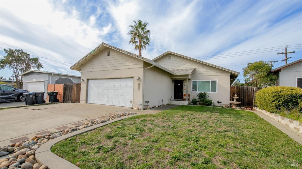 ranch-style home with a garage and a front yard