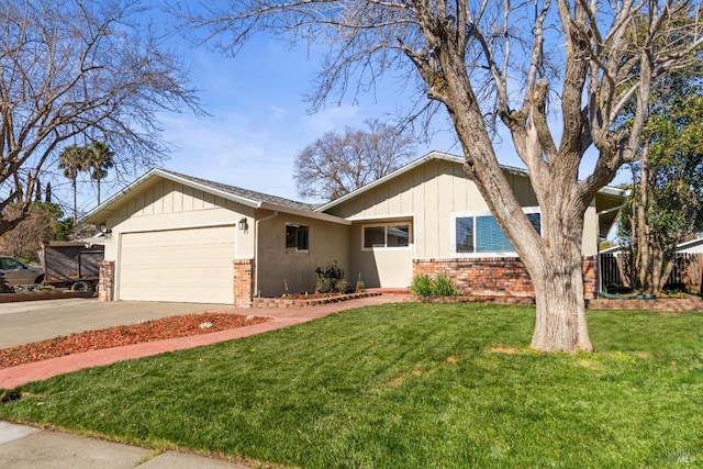 view of front of property featuring a garage and a front lawn