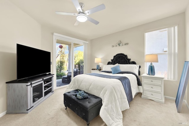 bedroom featuring ceiling fan, light carpet, and access to outside