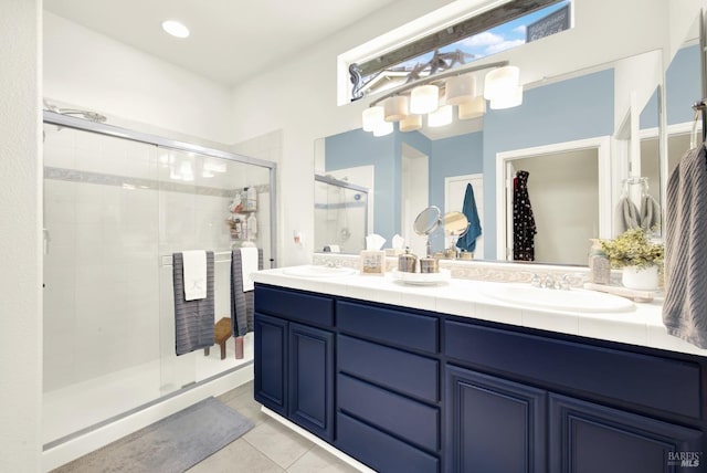 bathroom with vanity, tile patterned floors, and walk in shower