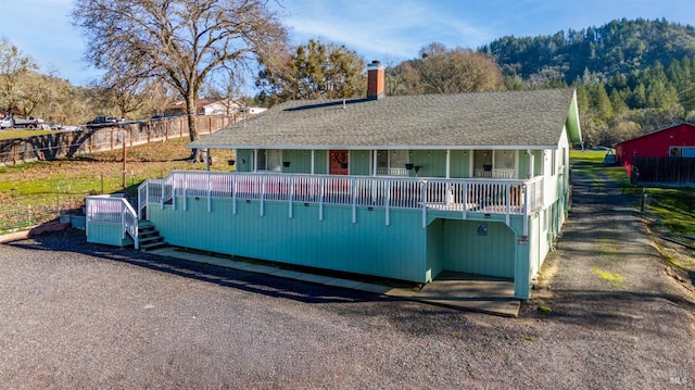 exterior space featuring a mountain view