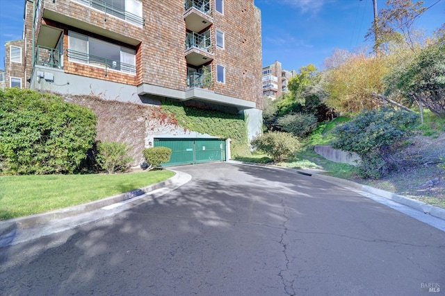 view of property with an attached garage and driveway