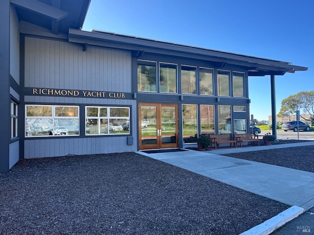 view of exterior entry featuring french doors