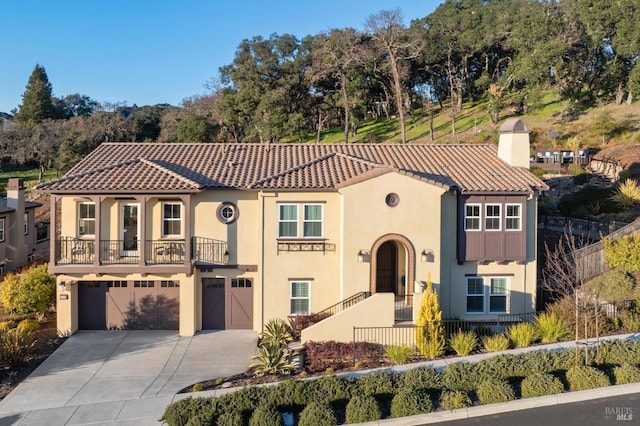 mediterranean / spanish house featuring a garage