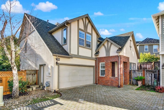 tudor-style house with a garage