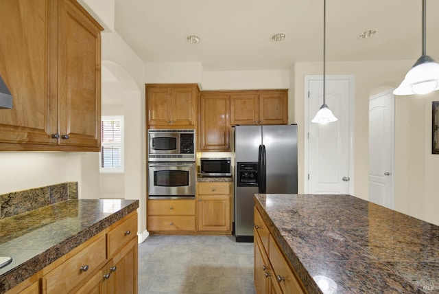 kitchen featuring pendant lighting and stainless steel appliances