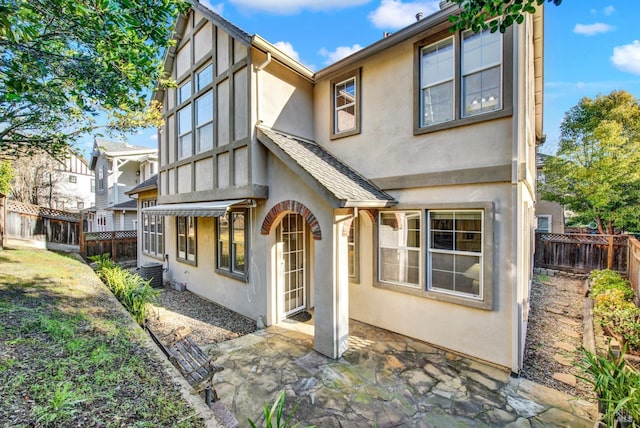 back of property with a patio area