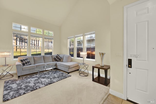 living room with high vaulted ceiling