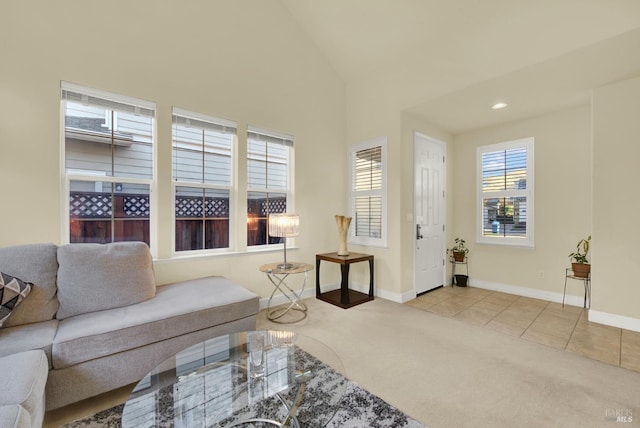 living room featuring lofted ceiling and light carpet