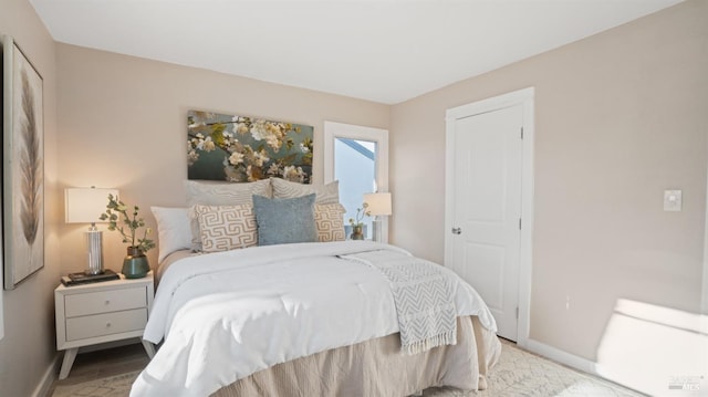 bedroom with wood-type flooring