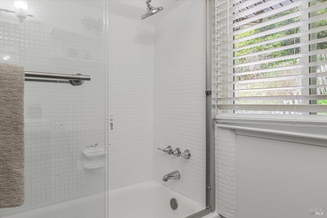 full bathroom featuring shower / bath combination with glass door