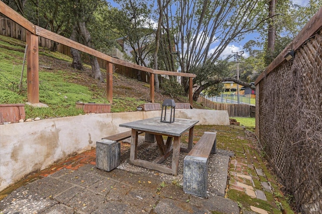 view of patio featuring fence