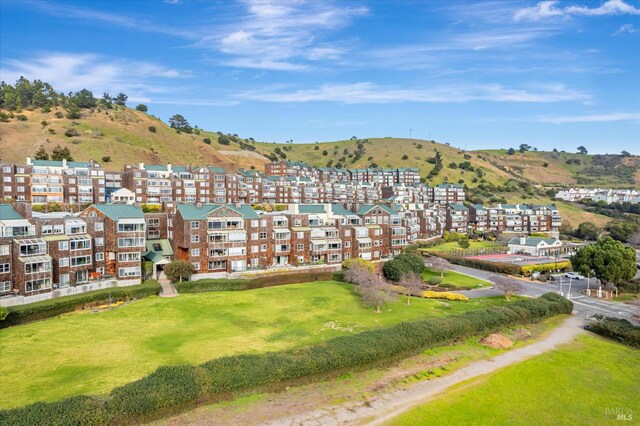 birds eye view of property featuring a mountain view