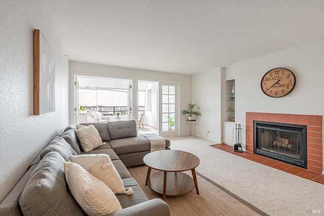 1300 Quarry Ct Unit 213, Richmond, CA 94801 - living area with built in features, carpet, and a tile fireplace