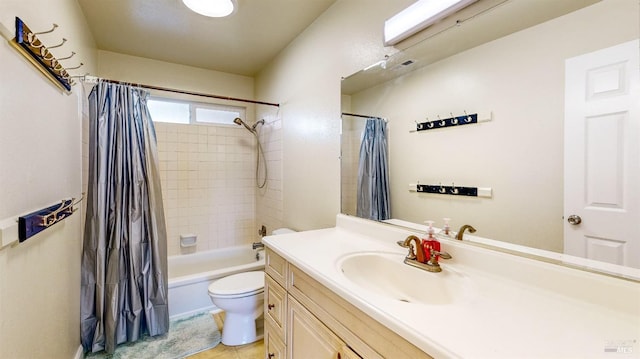 full bathroom with shower / bath combination with curtain, tile patterned floors, vanity, and toilet