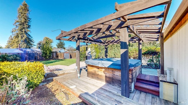 deck featuring a hot tub, a pergola, and a shed