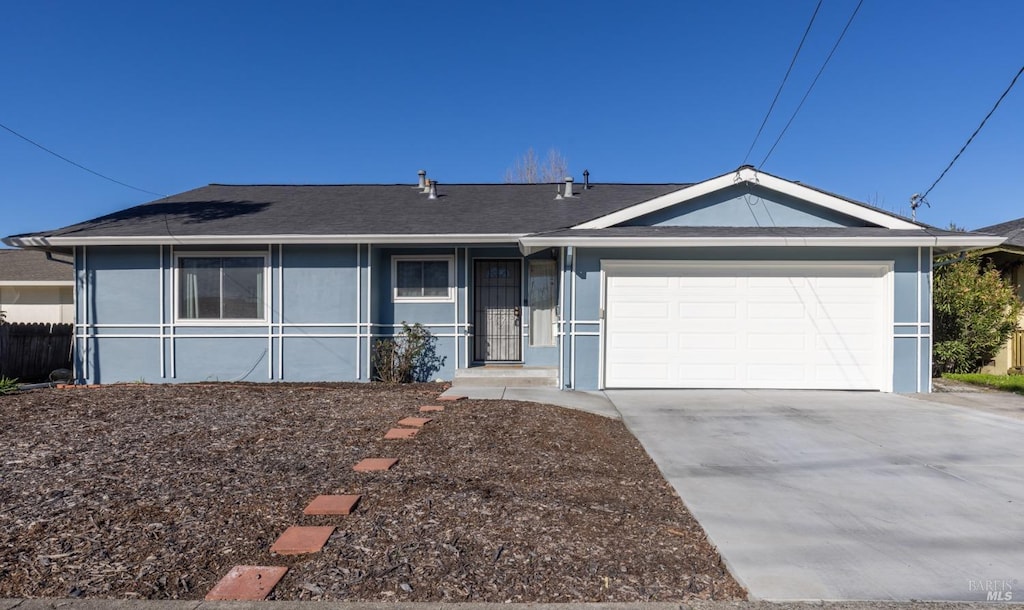 ranch-style home with a garage