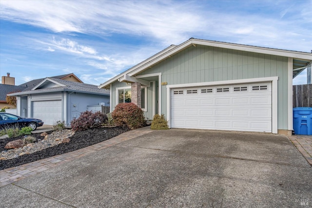 single story home featuring a garage