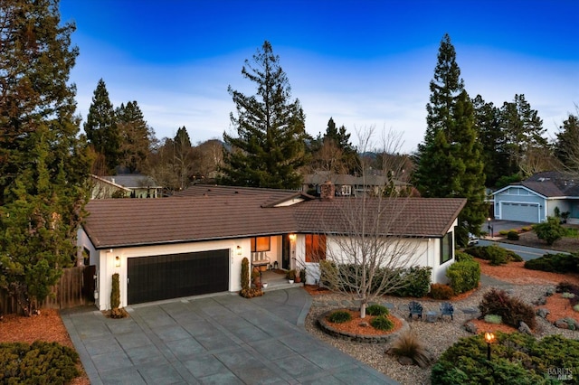 single story home with a garage