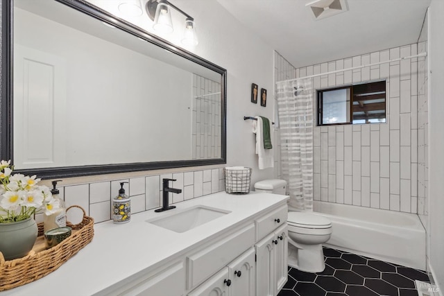 full bathroom with shower / tub combo with curtain, toilet, vanity, tile patterned flooring, and decorative backsplash