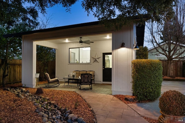 exterior space featuring ceiling fan