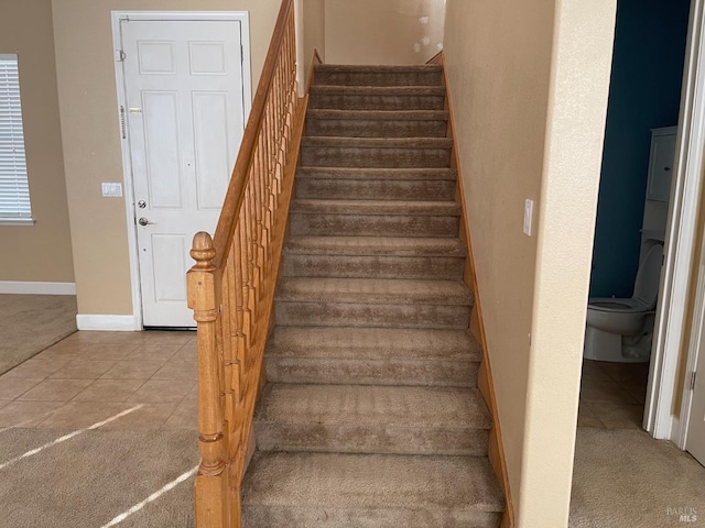 staircase with tile patterned flooring