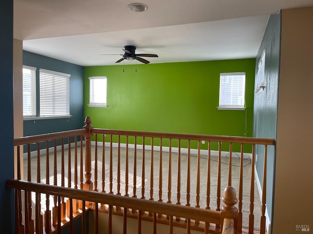 interior space featuring ceiling fan