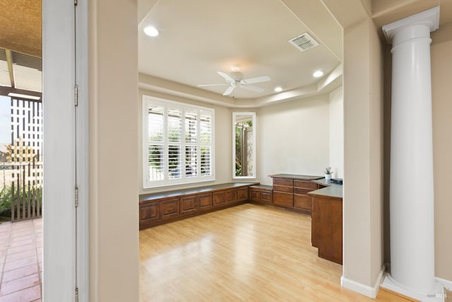 bathroom featuring ornate columns, hardwood / wood-style floors, and ceiling fan