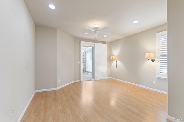 unfurnished room with ceiling fan, plenty of natural light, and light hardwood / wood-style flooring