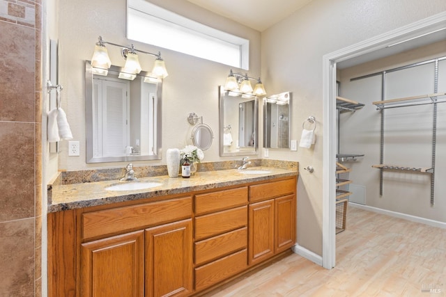 bathroom featuring vanity and hardwood / wood-style flooring