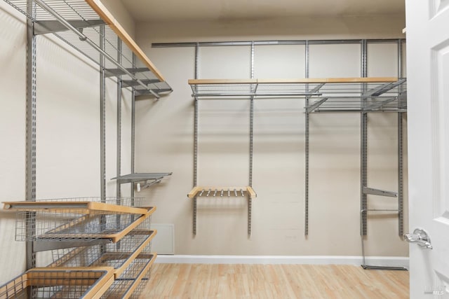 walk in closet featuring hardwood / wood-style floors