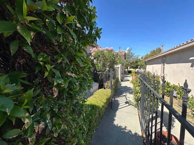 view of property's community featuring fence