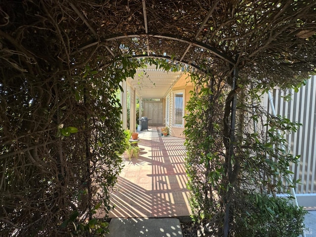 view of gate with a pergola