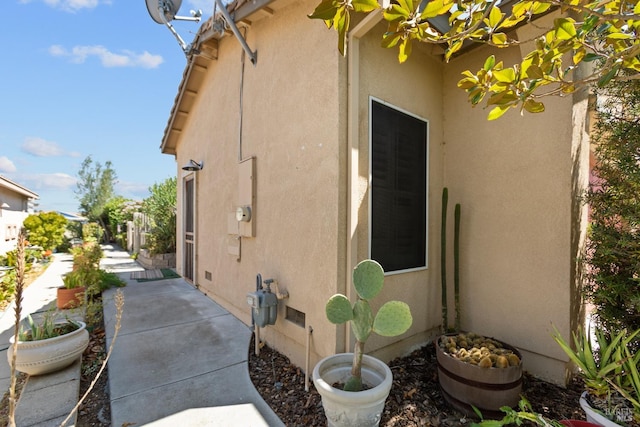 exterior space with a patio and stucco siding