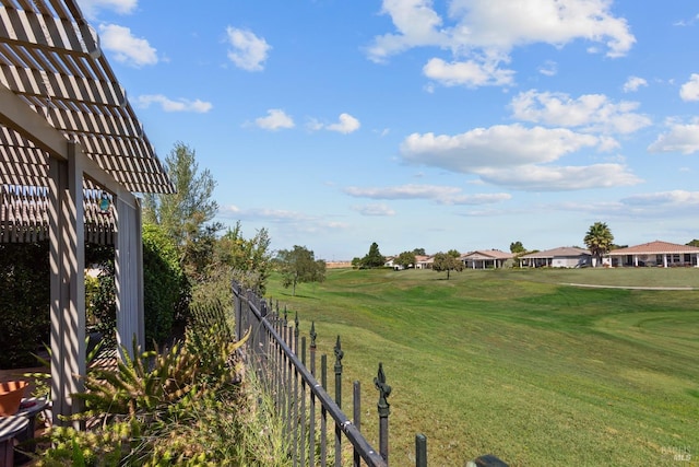 view of yard with fence and a pergola