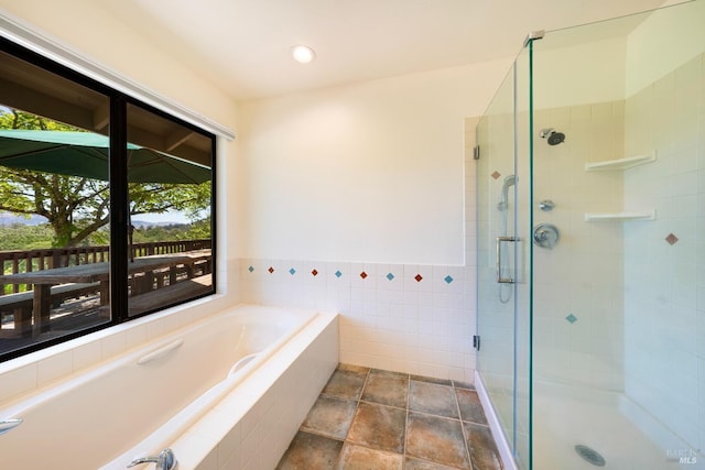 bathroom with independent shower and bath