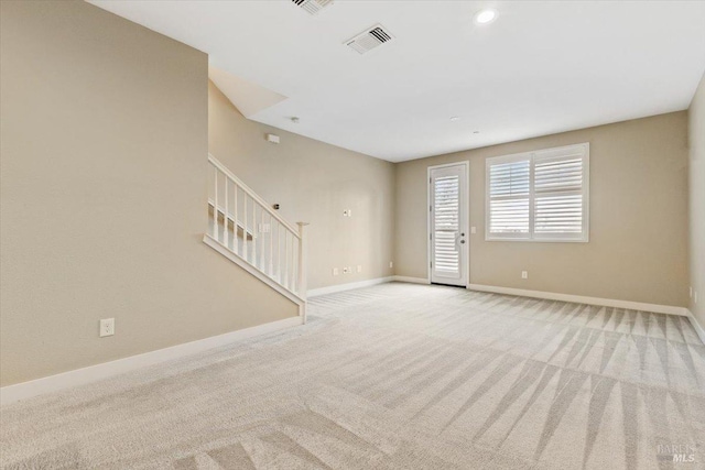 interior space with baseboards, recessed lighting, visible vents, carpet, and stairs
