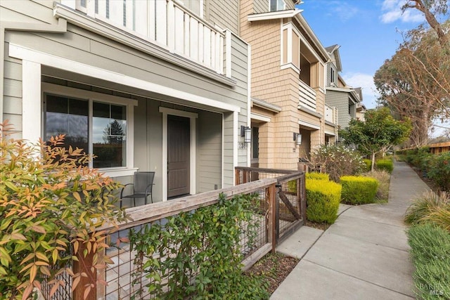 view of side of home featuring a porch