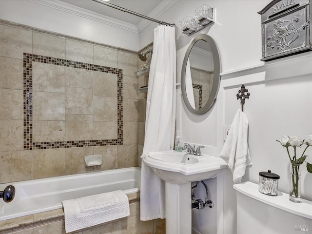 full bathroom featuring ornamental molding, shower / tub combo with curtain, and toilet