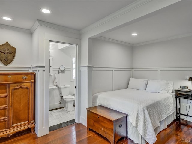 bedroom featuring a wainscoted wall, dark wood-type flooring, recessed lighting, and crown molding