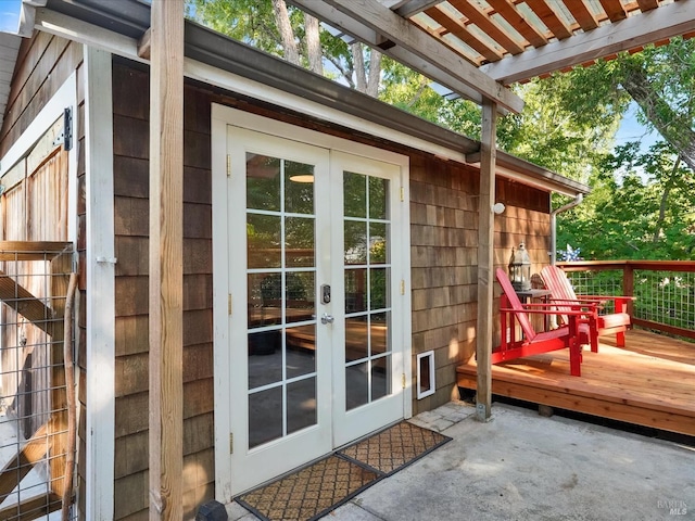 exterior space with a wooden deck and french doors