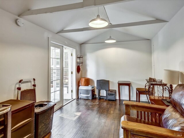 living area featuring lofted ceiling with beams and dark hardwood / wood-style floors