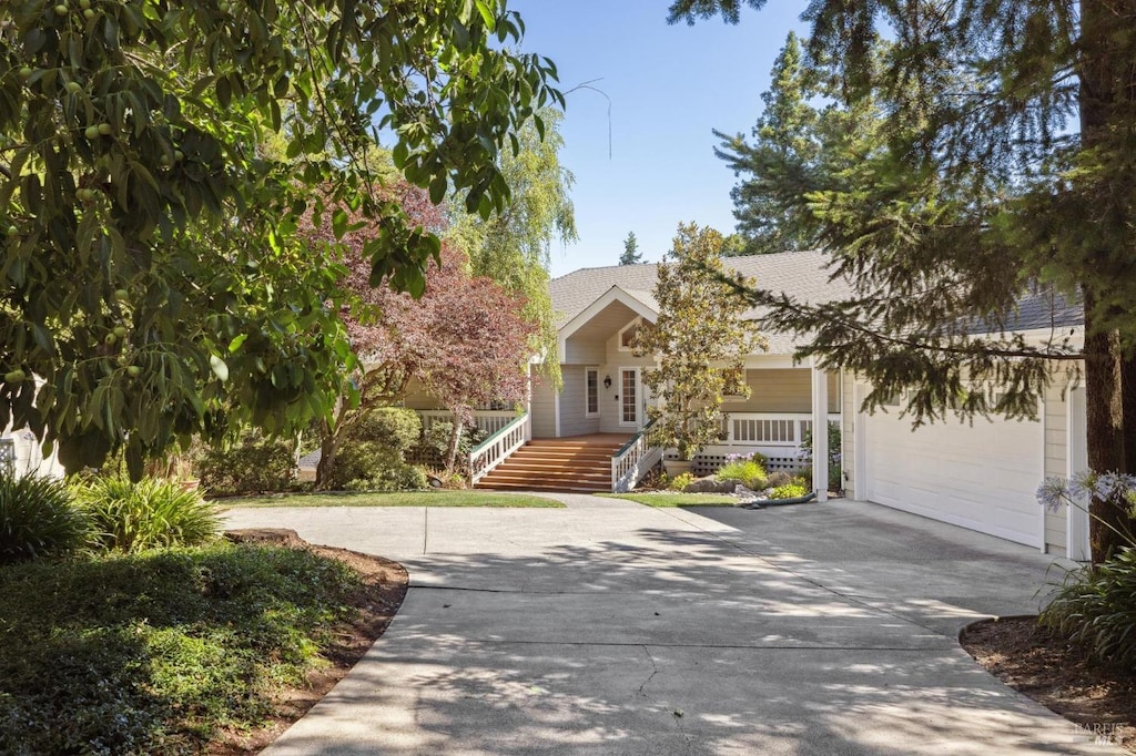 obstructed view of property with a garage