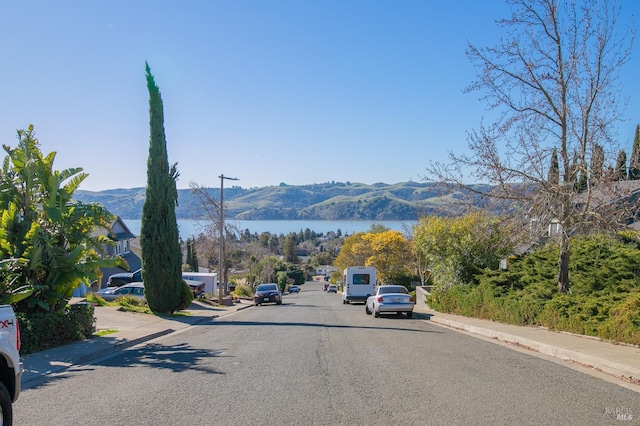 view of street with a water and mountain view